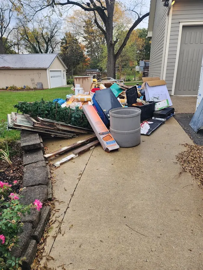 Dumpster being loaded with debris for Residential Dumpster Rental in Shaftsbury